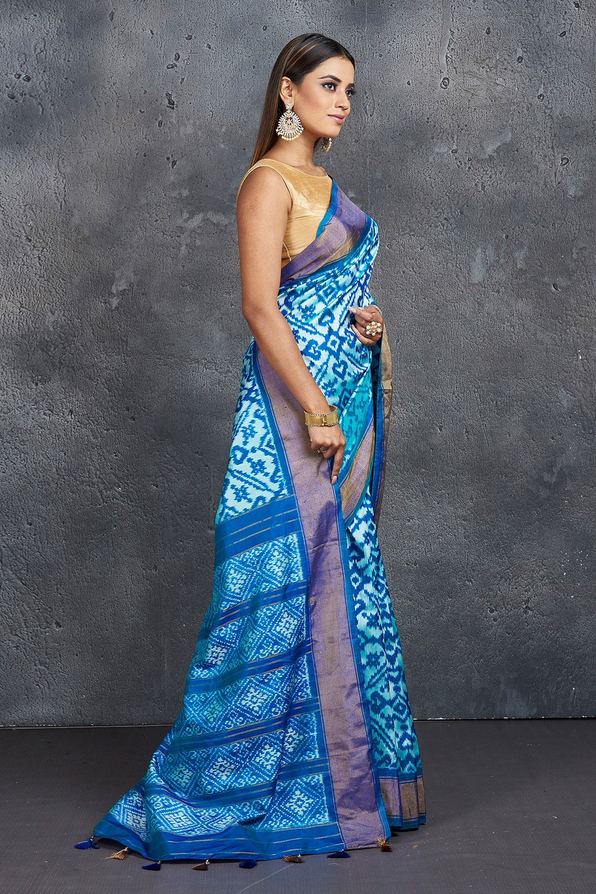 Buy stunning light blue ikkat silk saree online in USA with blue zari border. Keep your ethnic wardrobe up to date with latest designer sarees, pure silk sarees, Kanchipuram silk sarees, handwoven sarees, tussar silk sarees, embroidered sarees from Pure Elegance Indian saree store in USA.-side