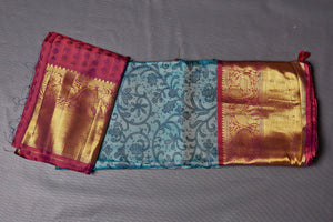 Buy elegant blue printed Kanjivaram saree online in USA with magenta zari border. Keep your ethnic wardrobe up to date with latest designer sarees, pure silk sarees, Kanchipuram silk sarees, handwoven sarees, tussar silk sarees, embroidered sarees from Pure Elegance Indian saree store in USA.-blouse