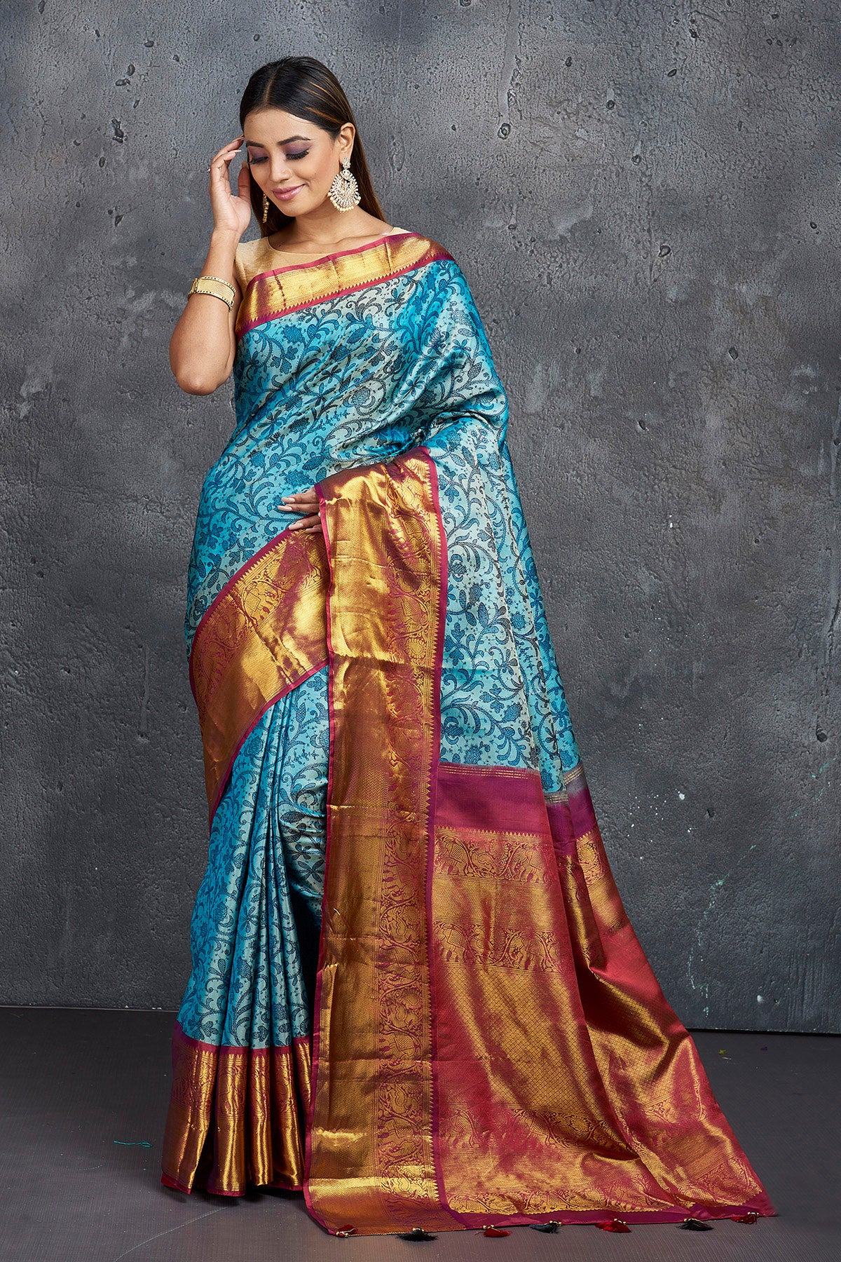 Buy elegant blue printed Kanjivaram saree online in USA with magenta zari border. Keep your ethnic wardrobe up to date with latest designer sarees, pure silk sarees, Kanchipuram silk sarees, handwoven sarees, tussar silk sarees, embroidered sarees from Pure Elegance Indian saree store in USA.-full view