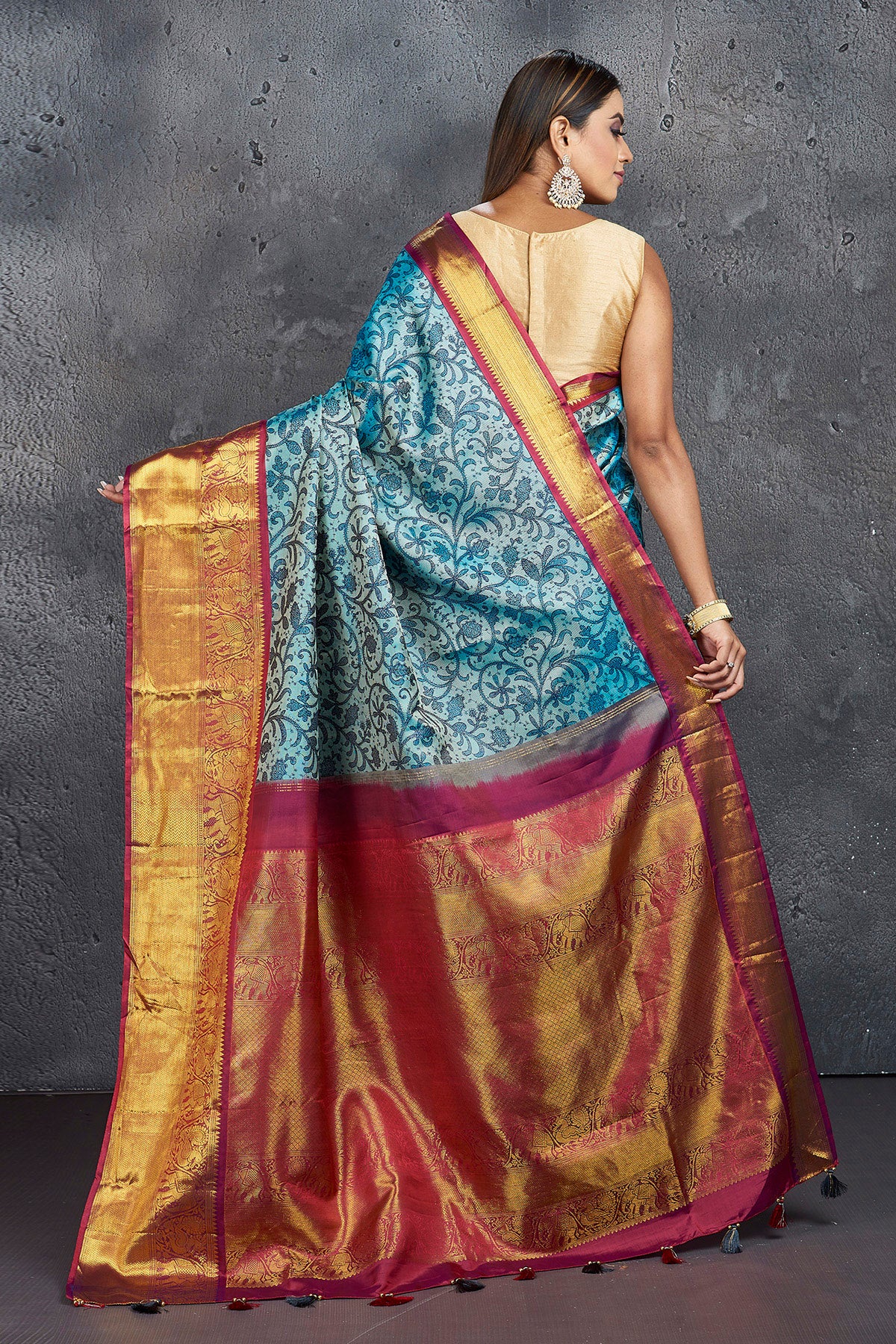 Buy elegant blue printed Kanjivaram saree online in USA with magenta zari border. Keep your ethnic wardrobe up to date with latest designer sarees, pure silk sarees, Kanchipuram silk sarees, handwoven sarees, tussar silk sarees, embroidered sarees from Pure Elegance Indian saree store in USA.-back