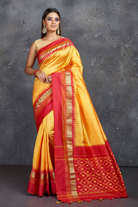 Shop beautiful yellow pure silk saree online in USA with ikkat pallu. Keep your ethnic wardrobe up to date with latest designer sarees, pure silk sarees, Kanchipuram silk sarees, handwoven sarees, tussar silk sarees, embroidered sarees from Pure Elegance Indian saree store in USA.-full view