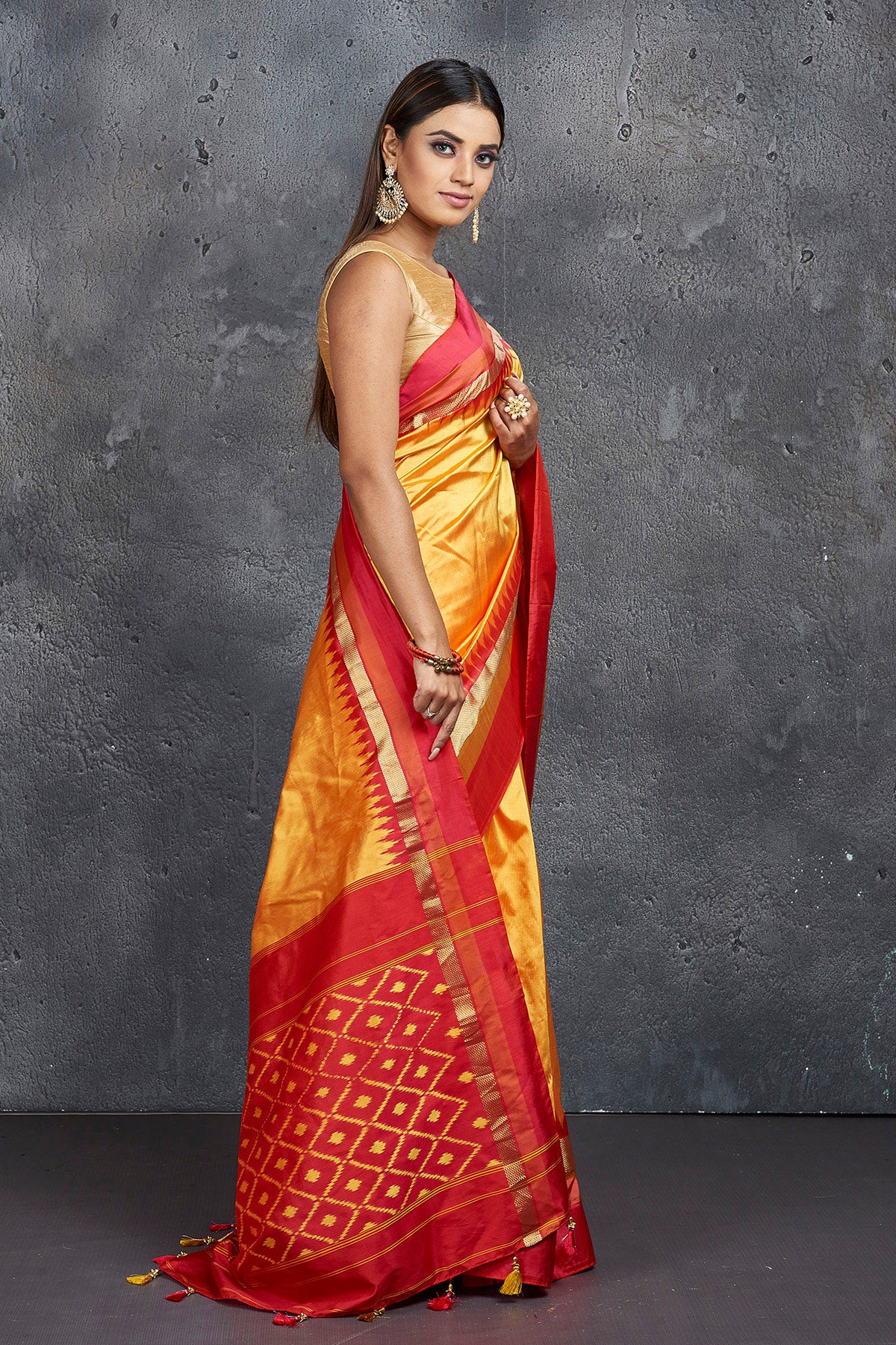 Shop beautiful yellow pure silk saree online in USA with ikkat pallu. Keep your ethnic wardrobe up to date with latest designer sarees, pure silk sarees, Kanchipuram silk sarees, handwoven sarees, tussar silk sarees, embroidered sarees from Pure Elegance Indian saree store in USA.-side