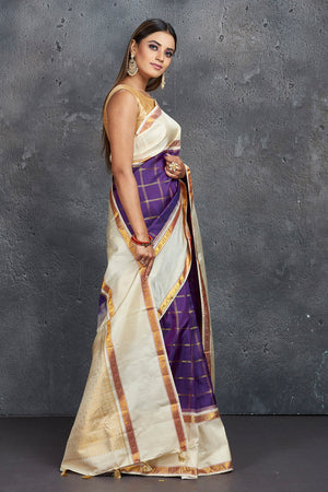 Buy stunning purple check Kanjivaram saree online in USA with cream space border. Keep your ethnic wardrobe up to date with latest designer sarees, pure silk sarees, Kanchipuram silk sarees, handwoven sarees, tussar silk sarees, embroidered sarees from Pure Elegance Indian saree store in USA.-side