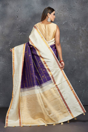Buy stunning purple check Kanjivaram saree online in USA with cream space border. Keep your ethnic wardrobe up to date with latest designer sarees, pure silk sarees, Kanchipuram silk sarees, handwoven sarees, tussar silk sarees, embroidered sarees from Pure Elegance Indian saree store in USA.-back