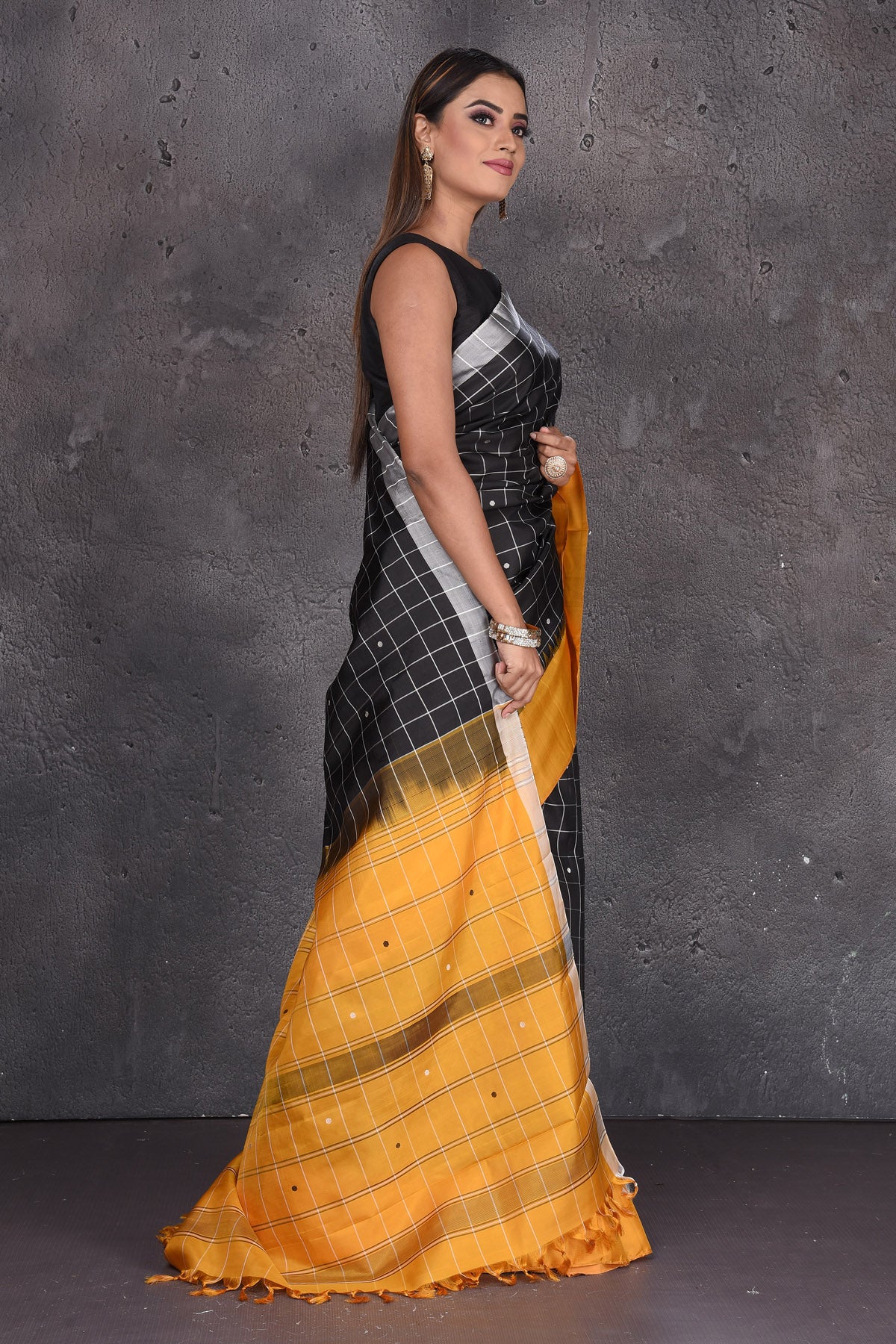 Buy beautiful black zari check Kanjeevaram silk saree online in USA with mustard border. Keep your ethnic wardrobe up to date with latest designer sarees, pure silk sarees, handwoven sarees, tussar silk sarees, embroidered sarees from Pure Elegance Indian saree store in USA.-side