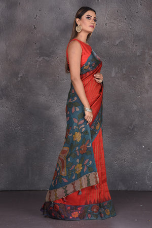 Shop stunning red silk sari online in USA with Kalamkari print pallu. Keep your ethnic wardrobe up to date with latest designer sarees, pure silk sarees, handwoven sarees, tussar silk sarees, embroidered sarees, printed sarees from Pure Elegance Indian saree store in USA.-side