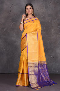 Shop yellow mangalgiri saree online in USA with purple zari pallu. Keep your ethnic wardrobe up to date with latest designer sarees, pure silk sarees, handwoven sarees, tussar silk sarees, embroidered sarees, printed sarees from Pure Elegance Indian saree store in USA.-full view