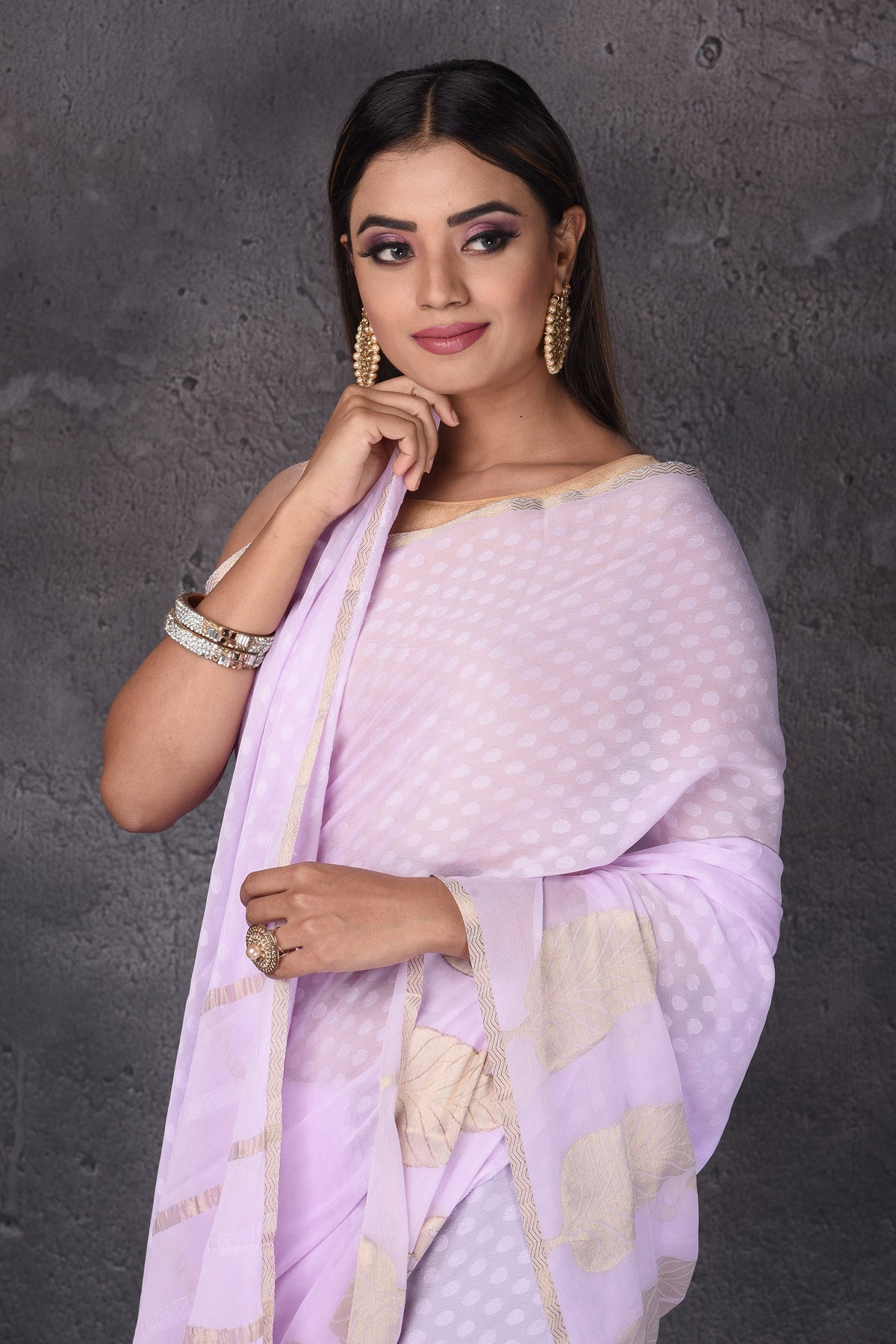 Shop stunning powder pink Mysore silk sari online in USA with paisley zari border. Keep your ethnic wardrobe up to date with latest designer sarees, pure silk sarees, handwoven sarees, tussar silk sarees, embroidered sarees, printed sarees from Pure Elegance Indian saree store in USA.-closeup