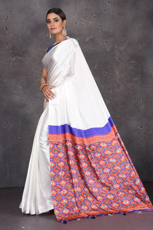 Buy elegant off-white modal silk sari online in USA with red printed pallu. Keep your ethnic wardrobe up to date with latest designer sarees, pure silk sarees, handwoven sarees, tussar silk sarees, embroidered sarees from Pure Elegance Indian saree store in USA.-pallu