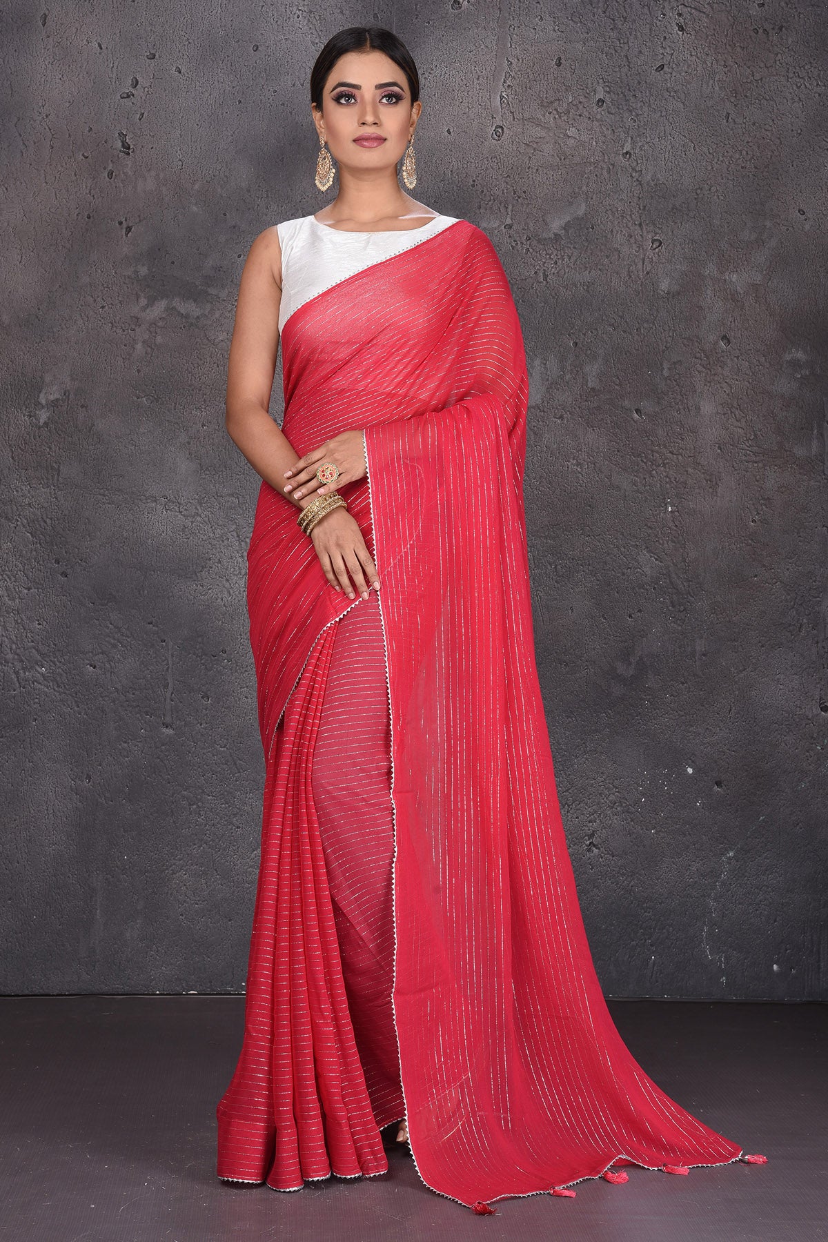 Shop gorgeous red fancy georgette sari online in USA with zari stripes. Keep your ethnic wardrobe up to date with latest designer sarees, pure silk sarees, handwoven sarees, tussar silk sarees, embroidered sarees from Pure Elegance Indian saree store in USA.-full view