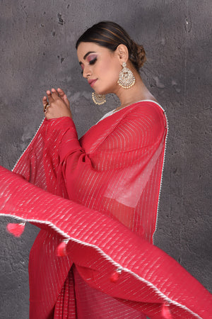 Shop gorgeous red fancy georgette sari online in USA with zari stripes. Keep your ethnic wardrobe up to date with latest designer sarees, pure silk sarees, handwoven sarees, tussar silk sarees, embroidered sarees from Pure Elegance Indian saree store in USA.-pallu