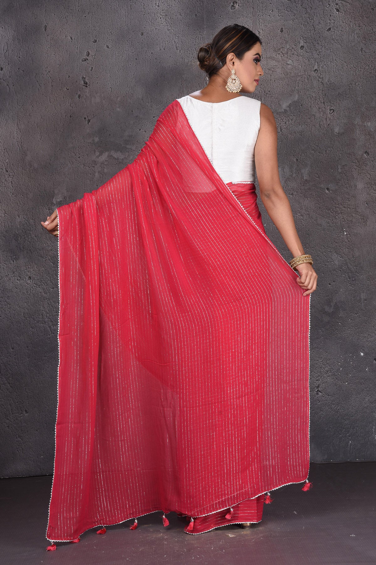 Shop gorgeous red fancy georgette sari online in USA with zari stripes. Keep your ethnic wardrobe up to date with latest designer sarees, pure silk sarees, handwoven sarees, tussar silk sarees, embroidered sarees from Pure Elegance Indian saree store in USA.-back
