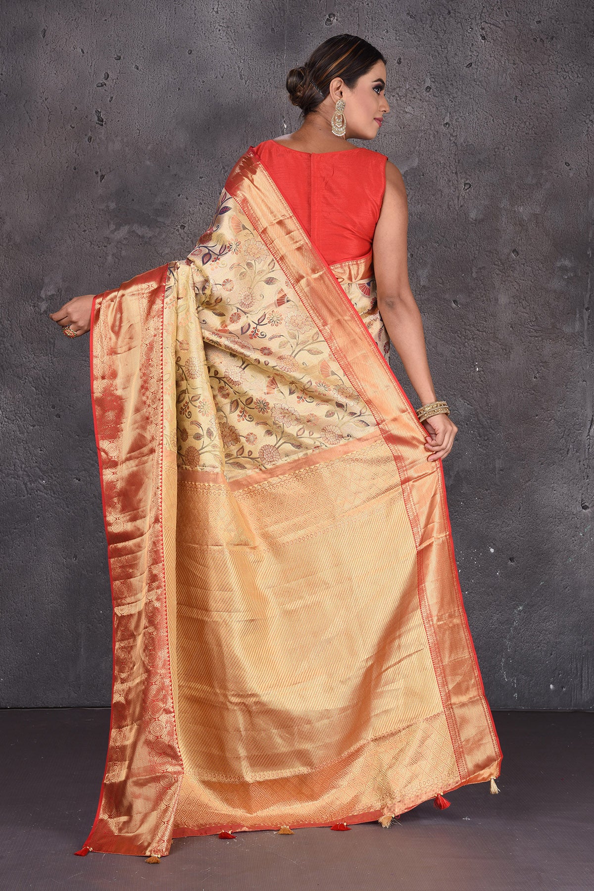 Shop stunning golden floral minakari zari Kanjeevaram sari online in USA with red golden border. Keep your ethnic wardrobe up to date with latest designer sarees, pure silk sarees, handwoven sarees, Kanchipuram silk sarees, embroidered sarees, georgette sarees from Pure Elegance Indian saree store in USA.-back