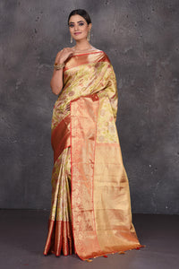 Buy stunning creamish gold floral minakari Kanjeevaram saree online in USA with red golden border. Keep your ethnic wardrobe up to date with latest designer sarees, pure silk sarees, handwoven sarees, Kanchipuram silk sarees, embroidered sarees, georgette sarees from Pure Elegance Indian saree store in USA.-full view