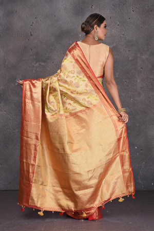 Buy stunning creamish gold floral minakari Kanjeevaram saree online in USA with red golden border. Keep your ethnic wardrobe up to date with latest designer sarees, pure silk sarees, handwoven sarees, Kanchipuram silk sarees, embroidered sarees, georgette sarees from Pure Elegance Indian saree store in USA.-back