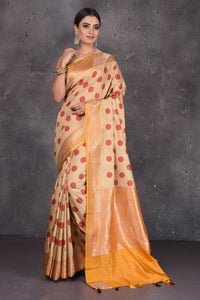 Buy beautiful beige polka dot tussar handloom saree online in USA with zari border. Keep your ethnic wardrobe up to date with latest designer sarees, pure silk sarees, handwoven sarees, Kanchipuram silk sarees, embroidered sarees, georgette sarees from Pure Elegance Indian saree store in USA.-full view