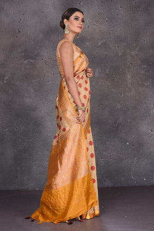 Buy beautiful beige polka dot tussar handloom saree online in USA with zari border. Keep your ethnic wardrobe up to date with latest designer sarees, pure silk sarees, handwoven sarees, Kanchipuram silk sarees, embroidered sarees, georgette sarees from Pure Elegance Indian saree store in USA.-side
