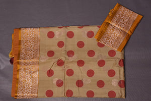 Buy beautiful beige polka dot tussar handloom saree online in USA with zari border. Keep your ethnic wardrobe up to date with latest designer sarees, pure silk sarees, handwoven sarees, Kanchipuram silk sarees, embroidered sarees, georgette sarees from Pure Elegance Indian saree store in USA.-blouse