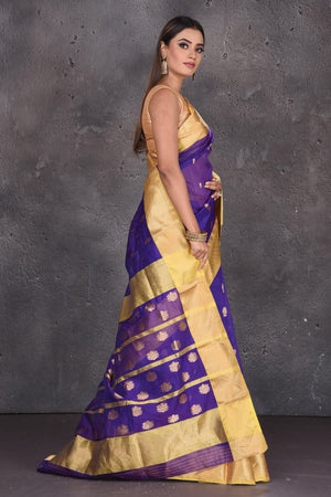 Shop stunning purple Katan silk sari online in USA with golden zari border. Keep your ethnic wardrobe up to date with latest designer sarees, pure silk sarees, handwoven sarees, tussar silk sarees, embroidered saris from Pure Elegance Indian saree store in USA.-side