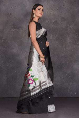 Shop black Paithani silk saree online in USA with single muniya zari border. Keep your ethnic wardrobe up to date with latest designer sarees, pure silk sarees, handwoven sarees, tussar silk sarees, embroidered saris, Paithani sarees from Pure Elegance Indian saree store in USA.-side