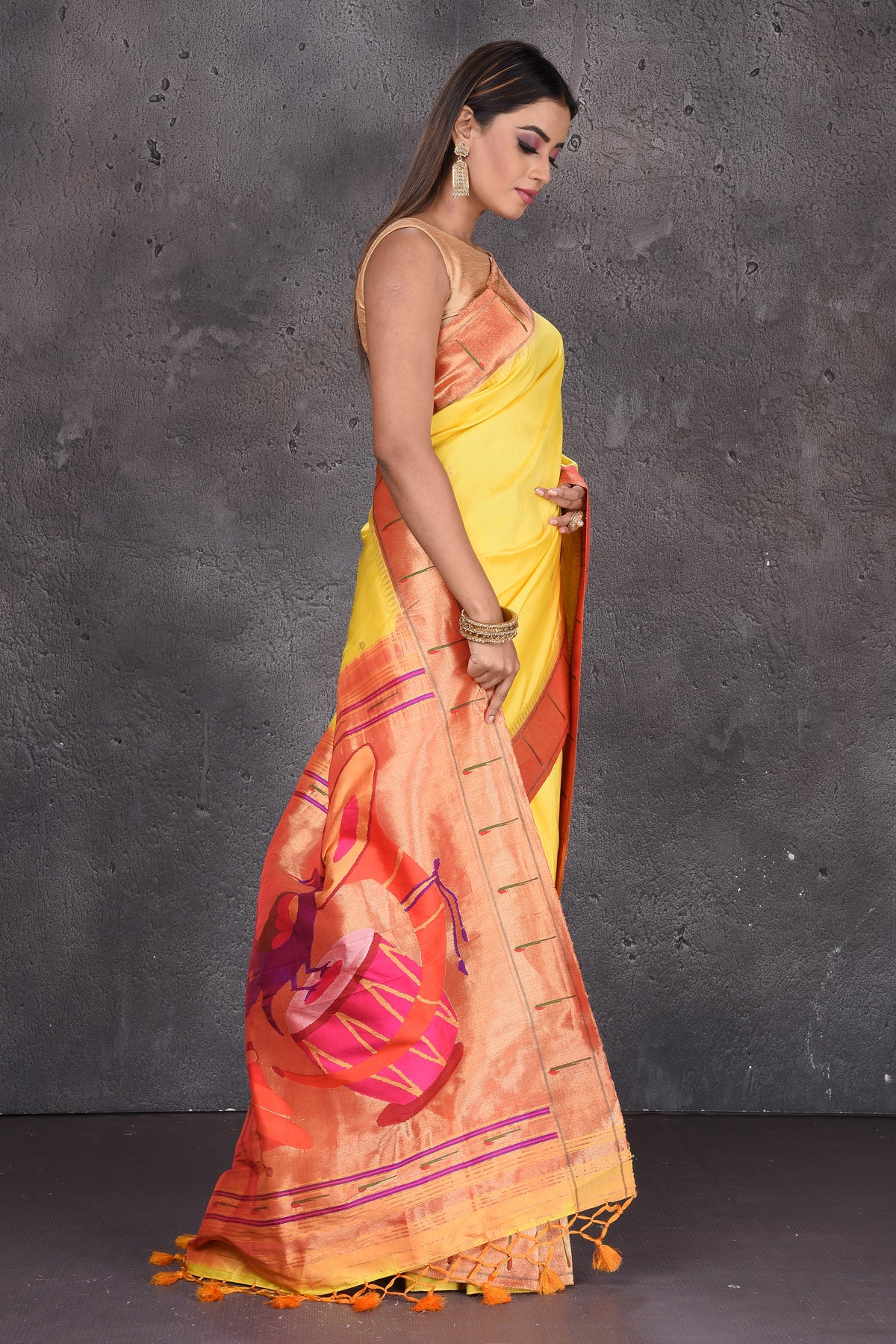 Shop beautifful yellow Paithani silk sari online in USA with single muniya zari border. Keep your ethnic wardrobe up to date with latest designer sarees, pure silk sarees, handwoven sarees, tussar silk sarees, embroidered saris, Paithani sarees from Pure Elegance Indian saree store in USA.-side