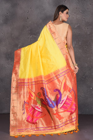 Shop beautifful yellow Paithani silk sari online in USA with single muniya zari border. Keep your ethnic wardrobe up to date with latest designer sarees, pure silk sarees, handwoven sarees, tussar silk sarees, embroidered saris, Paithani sarees from Pure Elegance Indian saree store in USA.-back