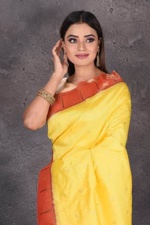 Shop beautifful yellow Paithani silk sari online in USA with single muniya zari border. Keep your ethnic wardrobe up to date with latest designer sarees, pure silk sarees, handwoven sarees, tussar silk sarees, embroidered saris, Paithani sarees from Pure Elegance Indian saree store in USA.-closeup