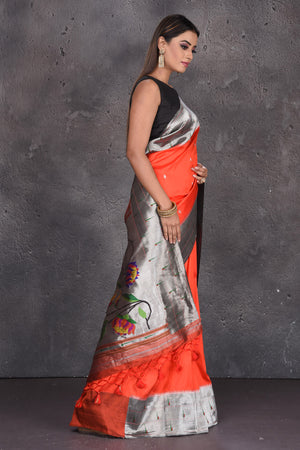 Buy stunning orange Paithani silk sari online in USA with red lotus pallu. Keep your ethnic wardrobe up to date with latest designer sarees, pure silk sarees, handwoven sarees, tussar silk sarees, embroidered saris, Paithani sarees from Pure Elegance Indian saree store in USA.-side