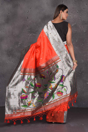 Buy stunning orange Paithani silk sari online in USA with red lotus pallu. Keep your ethnic wardrobe up to date with latest designer sarees, pure silk sarees, handwoven sarees, tussar silk sarees, embroidered saris, Paithani sarees from Pure Elegance Indian saree store in USA.-back