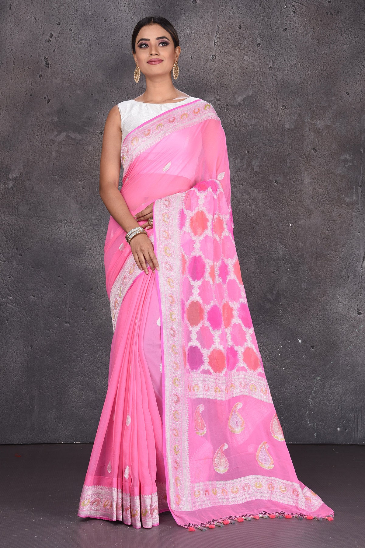 Buy beautiful neon pink Banarasi silk saree online in USA with silver zari border. Keep your ethnic wardrobe up to date with latest designer saris, pure silk sarees, handwoven silk sarees, tussar silk sarees, Benarasi sarees, embroidered sarees from Pure Elegance Indian saree store in USA.-full view