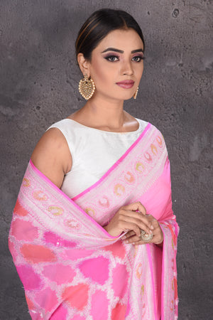 Buy beautiful neon pink Banarasi silk saree online in USA with silver zari border. Keep your ethnic wardrobe up to date with latest designer saris, pure silk sarees, handwoven silk sarees, tussar silk sarees, Benarasi sarees, embroidered sarees from Pure Elegance Indian saree store in USA.-closeup