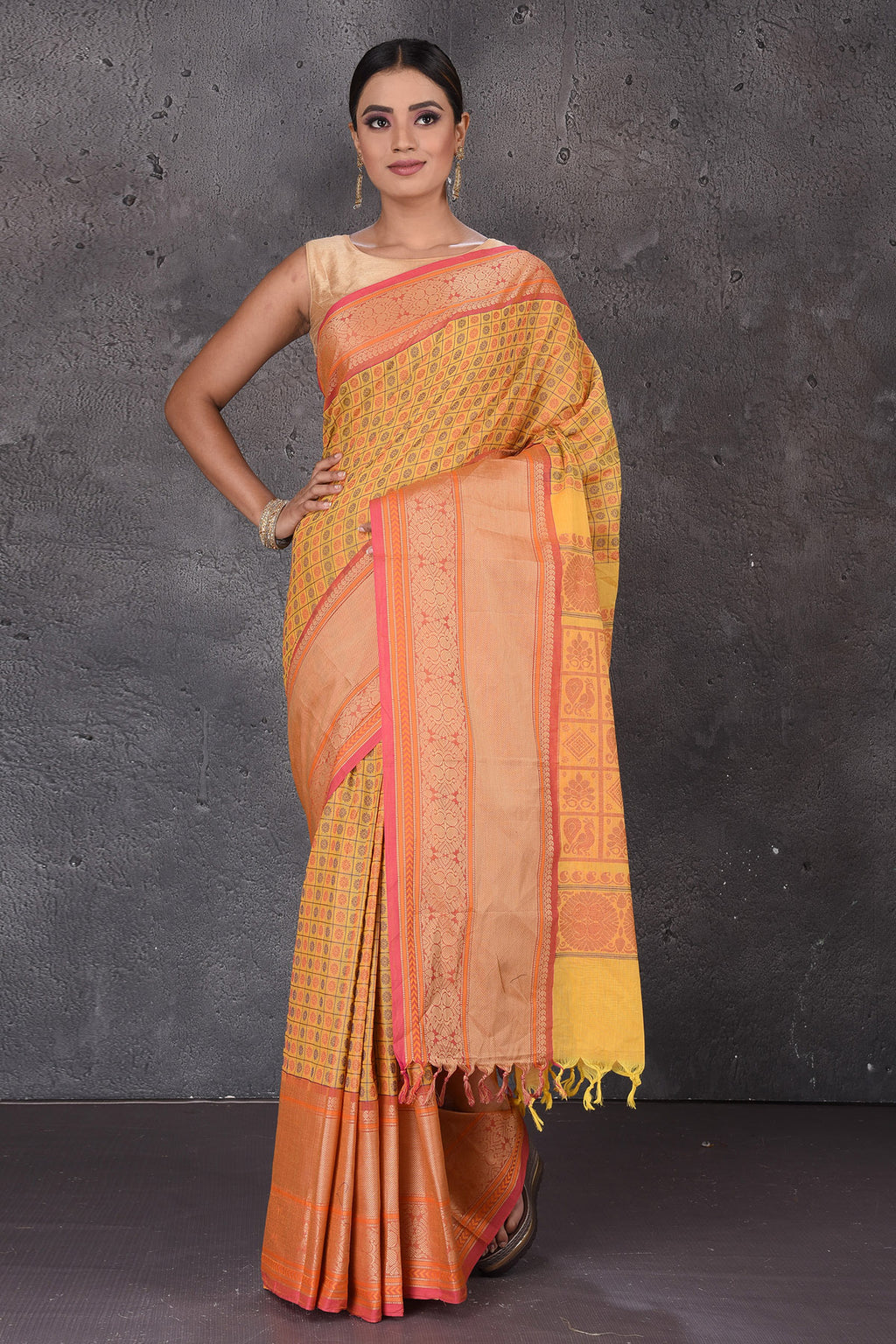 Buy yellow Kanchipuram cotton saree online in USA with pink zari border. Flaunt your ethnic style on special occasions with latest designer sarees, pure silk sarees, handwoven sarees, Kanchipuram silk sarees, embroidered sarees, georgette sarees from Pure Elegance Indian saree store in USA.-full view
