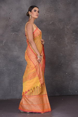 Buy yellow Kanchipuram cotton saree online in USA with pink zari border. Flaunt your ethnic style on special occasions with latest designer sarees, pure silk sarees, handwoven sarees, Kanchipuram silk sarees, embroidered sarees, georgette sarees from Pure Elegance Indian saree store in USA.-side