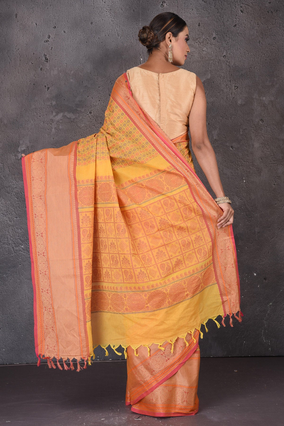 Buy yellow Kanchipuram cotton saree online in USA with pink zari border. Flaunt your ethnic style on special occasions with latest designer sarees, pure silk sarees, handwoven sarees, Kanchipuram silk sarees, embroidered sarees, georgette sarees from Pure Elegance Indian saree store in USA.-back