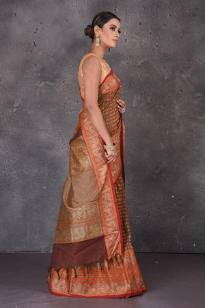 Shop stunning brown Kanchipuram cotton sari online in USA with red orange zari border. Flaunt your ethnic style on special occasions with latest designer sarees, pure silk sarees, handwoven sarees, Kanchipuram silk sarees, embroidered sarees, georgette sarees from Pure Elegance Indian saree store in USA.-side
