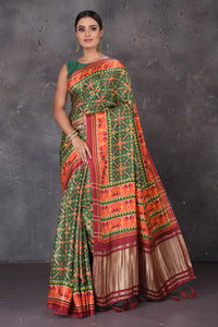 Shop beautiful green Patola print crepe silk saree online in USA with zari pallu. Flaunt your ethnic style on special occasions with latest designer sarees, pure silk sarees, handwoven sarees, Kanchipuram silk sarees, embroidered sarees, georgette sarees, party sarees from Pure Elegance Indian saree store in USA.-full view