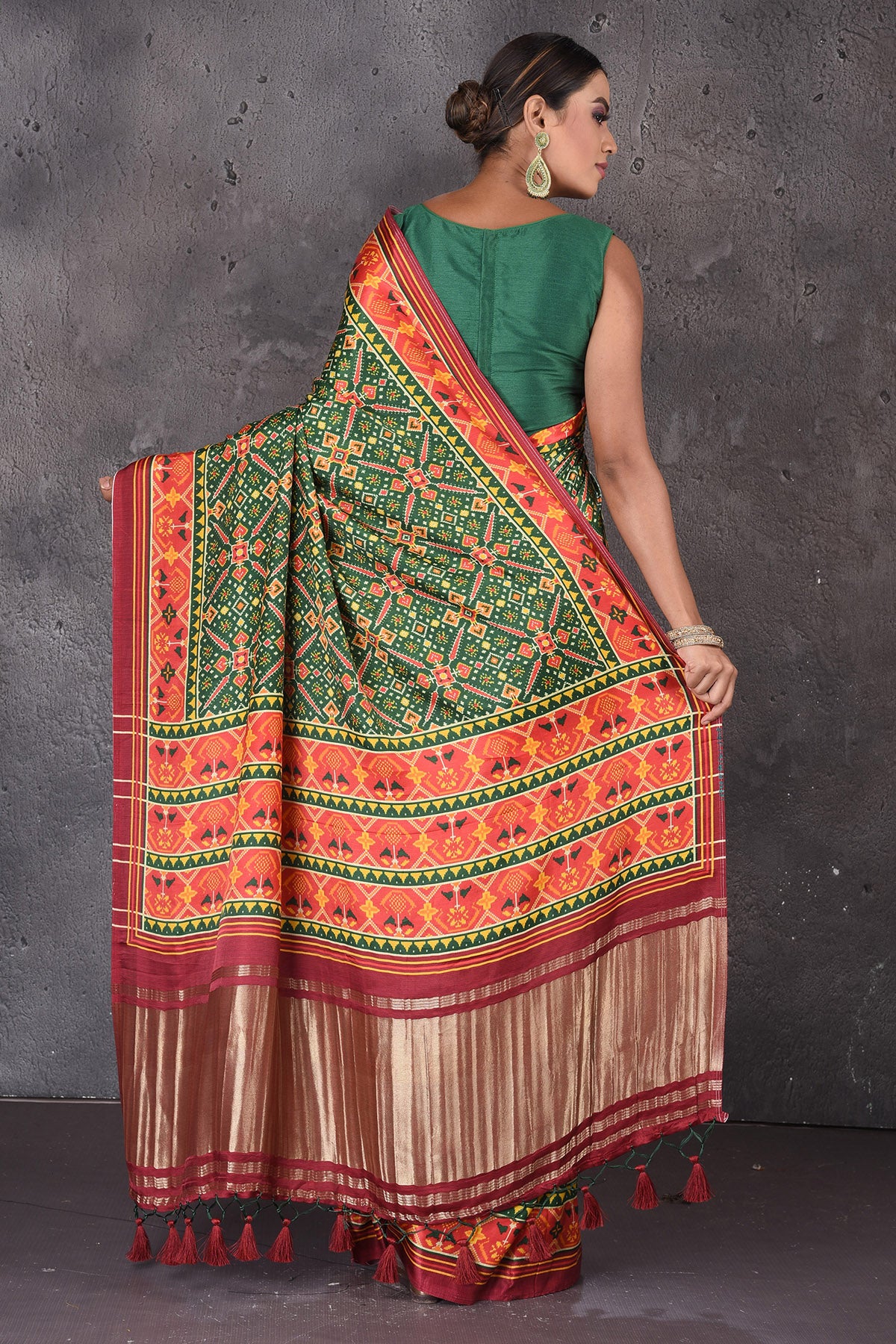Shop beautiful green Patola print crepe silk saree online in USA with zari pallu. Flaunt your ethnic style on special occasions with latest designer sarees, pure silk sarees, handwoven sarees, Kanchipuram silk sarees, embroidered sarees, georgette sarees, party sarees from Pure Elegance Indian saree store in USA.-back