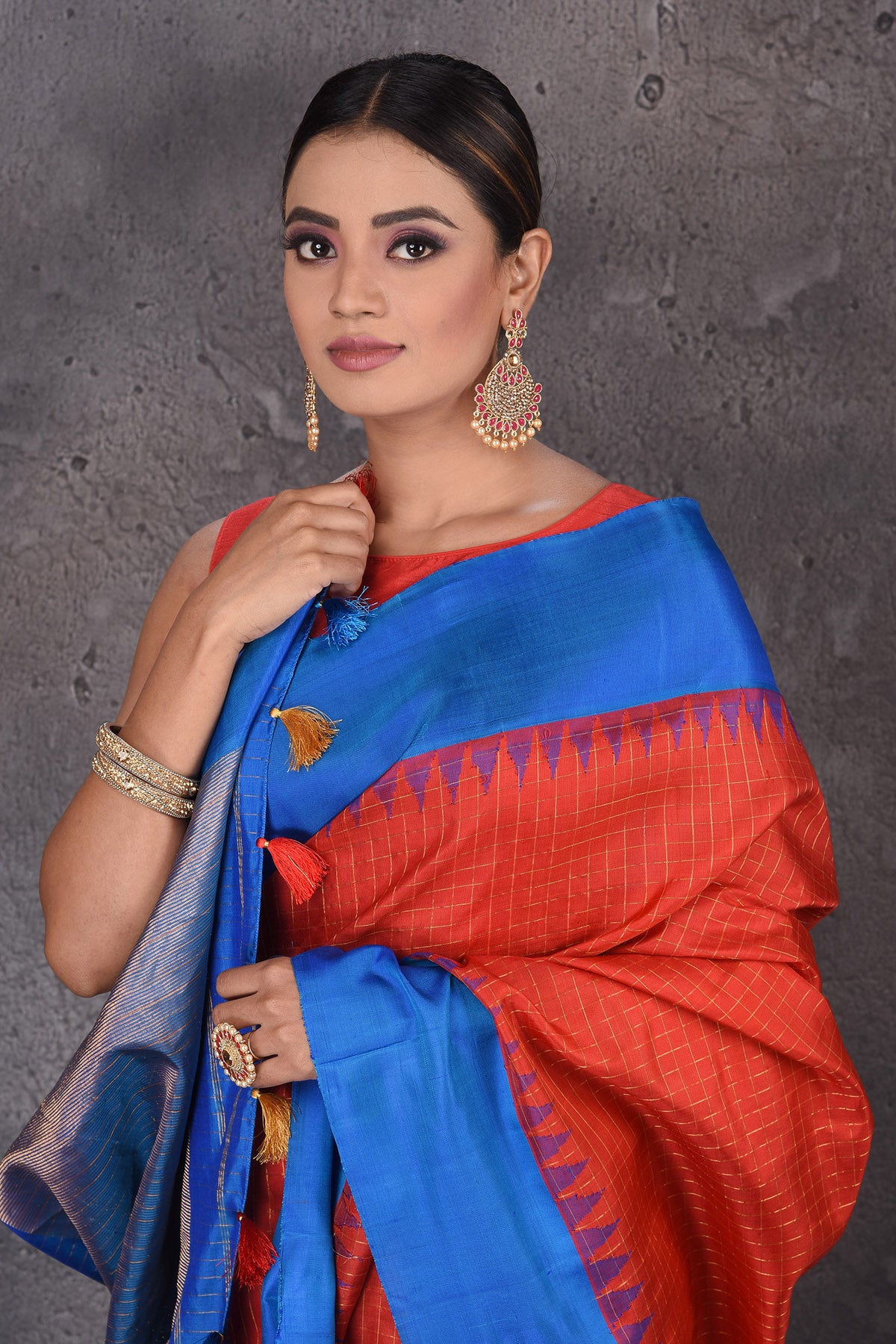 Buy stunning red zari check Gadhwal silk saree online in USA with blue temple border. Flaunt your ethnic style on special occasions with latest designer sarees, pure silk sarees, handwoven sarees, Kanchipuram silk sarees, embroidered sarees, georgette sarees, party sarees from Pure Elegance Indian saree store in USA.-closeup
