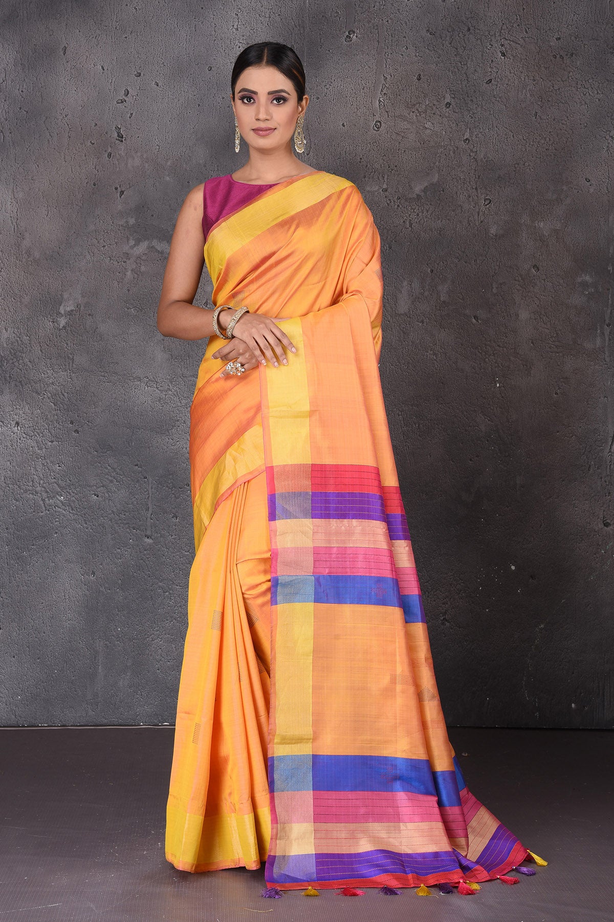 Buy beautiful yellow Bishnupur silk sari online in USA with pink and purple stripes pallu. Flaunt your ethnic style on special occasions with latest designer sarees, pure silk sarees, handwoven sarees, Kanchipuram silk sarees, embroidered sarees, georgette sarees, party sarees from Pure Elegance Indian saree store in USA.-full view