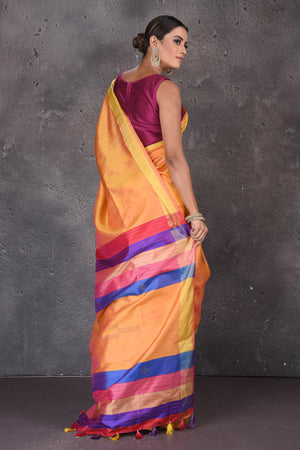 Buy beautiful yellow Bishnupur silk sari online in USA with pink and purple stripes pallu. Flaunt your ethnic style on special occasions with latest designer sarees, pure silk sarees, handwoven sarees, Kanchipuram silk sarees, embroidered sarees, georgette sarees, party sarees from Pure Elegance Indian saree store in USA.-back