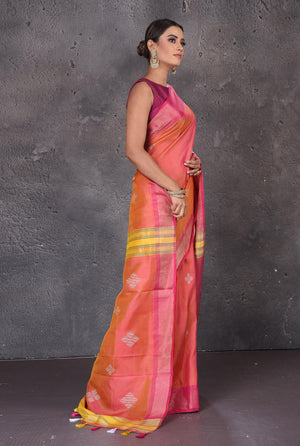 Shop beautiful orange Bishnupur silk saree online in USA with pink zari border. Flaunt your ethnic style on special occasions with latest designer sarees, pure silk sarees, handwoven sarees, Kanchipuram silk sarees, embroidered sarees, georgette sarees, party sarees from Pure Elegance Indian saree store in USA.-side