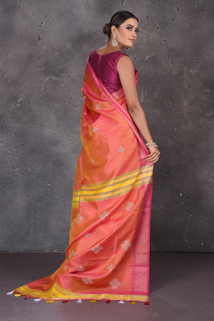 Shop beautiful orange Bishnupur silk saree online in USA with pink zari border. Flaunt your ethnic style on special occasions with latest designer sarees, pure silk sarees, handwoven sarees, Kanchipuram silk sarees, embroidered sarees, georgette sarees, party sarees from Pure Elegance Indian saree store in USA.-back