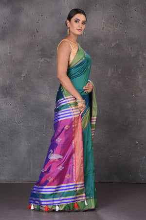 Shop stunning green Bishnupur silk sari online in USA with purple zari pallu. Flaunt your ethnic style on special occasions with latest designer sarees, pure silk sarees, handwoven sarees, Kanchipuram silk sarees, embroidered sarees, georgette sarees, party sarees from Pure Elegance Indian saree store in USA.-side