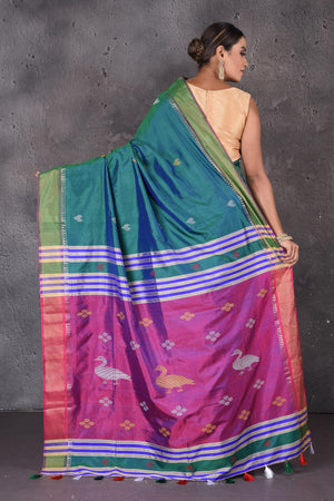 Shop stunning green Bishnupur silk sari online in USA with purple zari pallu. Flaunt your ethnic style on special occasions with latest designer sarees, pure silk sarees, handwoven sarees, Kanchipuram silk sarees, embroidered sarees, georgette sarees, party sarees from Pure Elegance Indian saree store in USA.-back