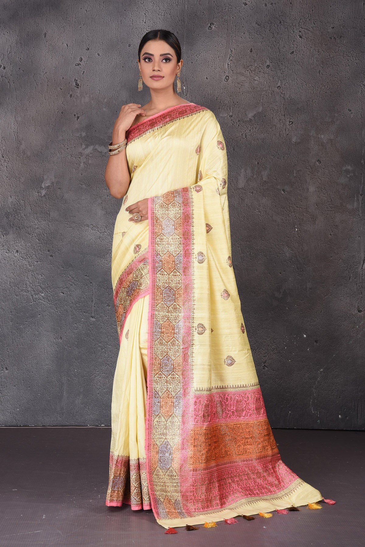 Buy stunning light yellow dupion silk saree online in USA with antique zari border. Flaunt your ethnic style on special occasions with latest designer sarees, pure silk sarees, handwoven sarees, Kanchipuram silk sarees, embroidered sarees, georgette sarees, party sarees from Pure Elegance Indian saree store in USA.-full view