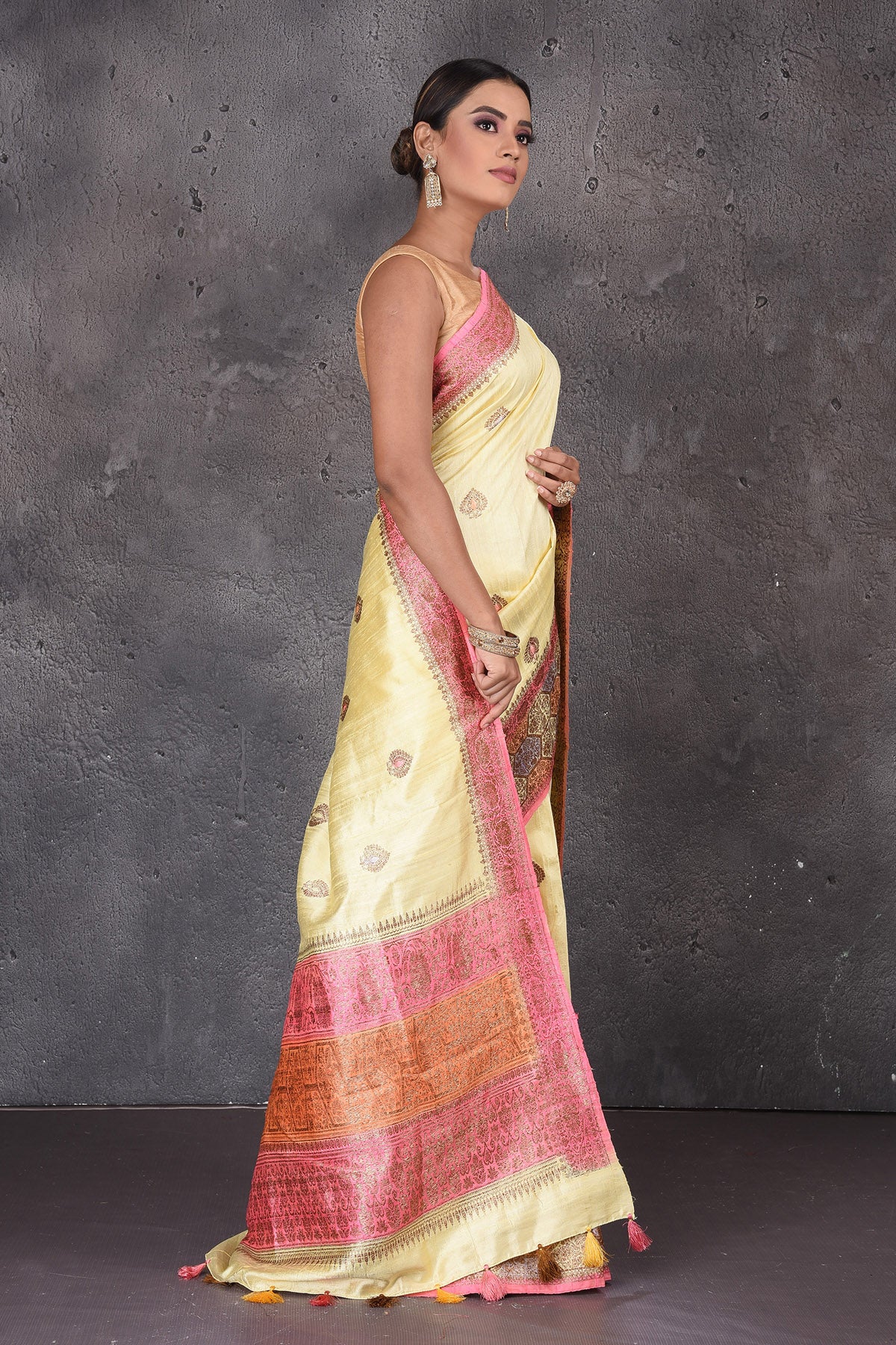 Buy stunning light yellow dupion silk saree online in USA with antique zari border. Flaunt your ethnic style on special occasions with latest designer sarees, pure silk sarees, handwoven sarees, Kanchipuram silk sarees, embroidered sarees, georgette sarees, party sarees from Pure Elegance Indian saree store in USA.-side