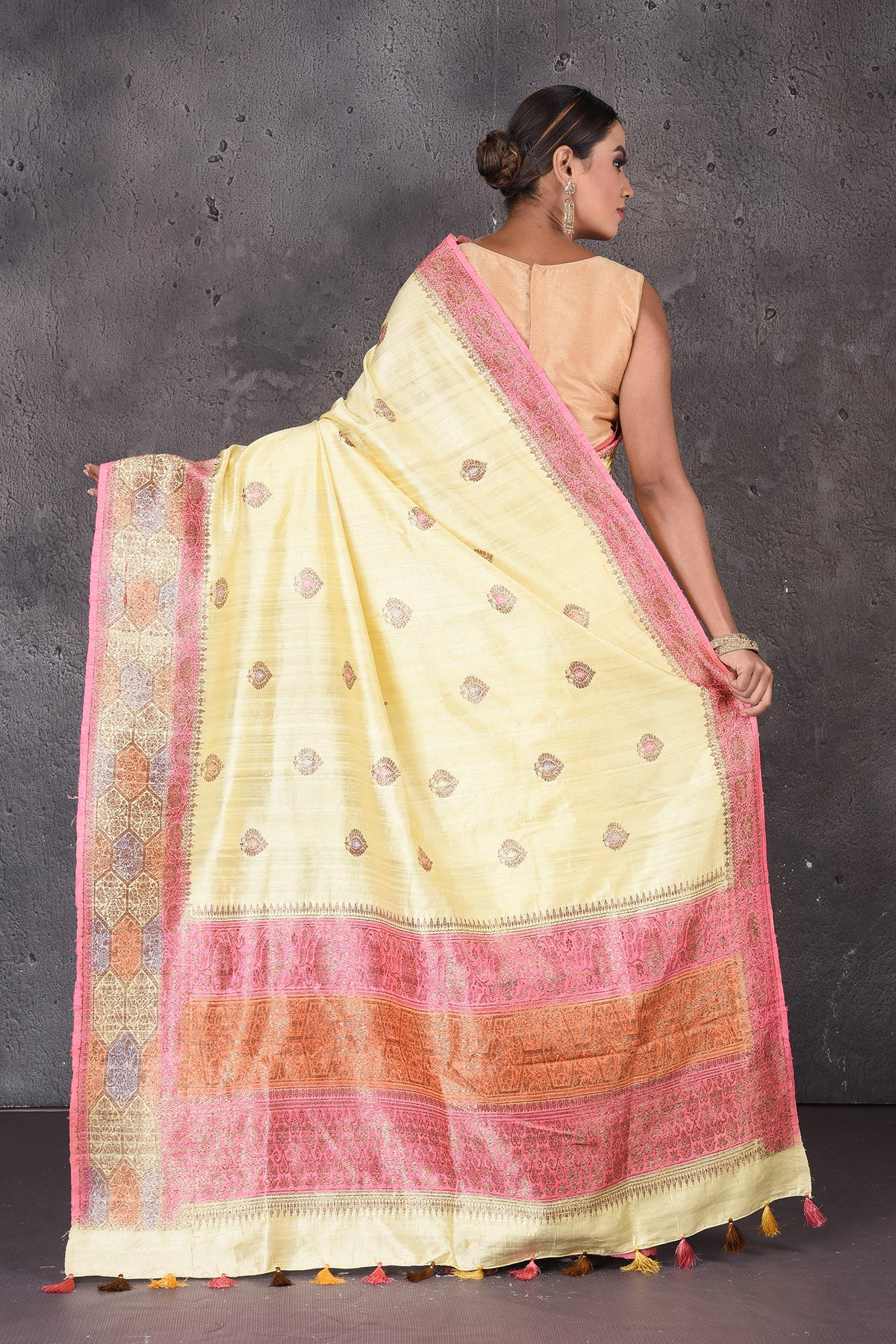 Buy stunning light yellow dupion silk saree online in USA with antique zari border. Flaunt your ethnic style on special occasions with latest designer sarees, pure silk sarees, handwoven sarees, Kanchipuram silk sarees, embroidered sarees, georgette sarees, party sarees from Pure Elegance Indian saree store in USA.-back