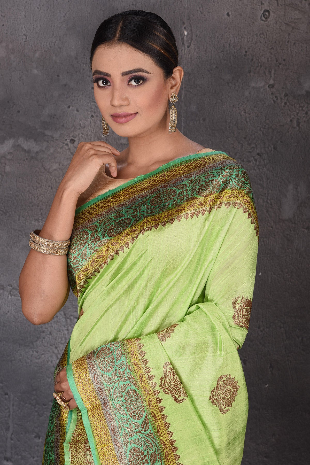Buy beautiful pastel green dupion silk sari online in USA with antique zari border. Flaunt your ethnic style on special occasions with latest designer sarees, pure silk sarees, handwoven sarees, Kanchipuram silk sarees, embroidered sarees, georgette sarees, party sarees from Pure Elegance Indian saree store in USA.-closeup