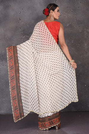 Shop stunning off-white printed georgette sari online in USA with embroidered border. Flaunt your ethnic style on special occasions with latest designer sarees, pure silk sarees, handwoven sarees, Kanchipuram silk sarees, embroidered sarees, georgette sarees, party sarees from Pure Elegance Indian saree store in USA.-back