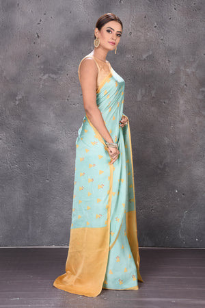 Shop stunning pastel green modal silk saree online in USA with printed buta. Keep your ethnic wardrobe up to date with latest designer sarees, pure silk sarees, handwoven sarees, tussar silk sarees, embroidered sarees from Pure Elegance Indian saree store in USA.-side